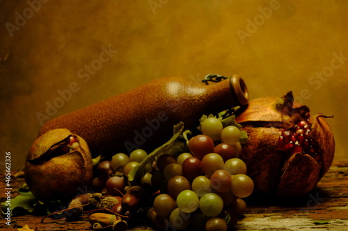 
ceramic bottle with grapes and pomegranates