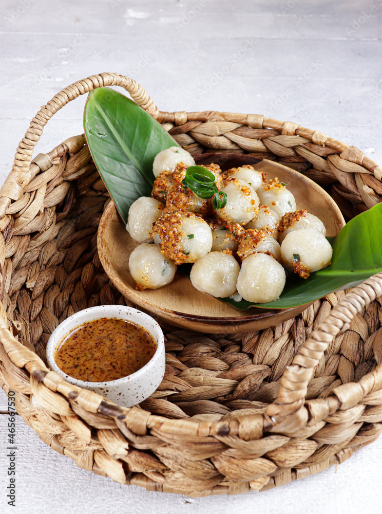Cilok is West Java Indonesia traditional snack made from tapioca flour, served with peanuts sauce.