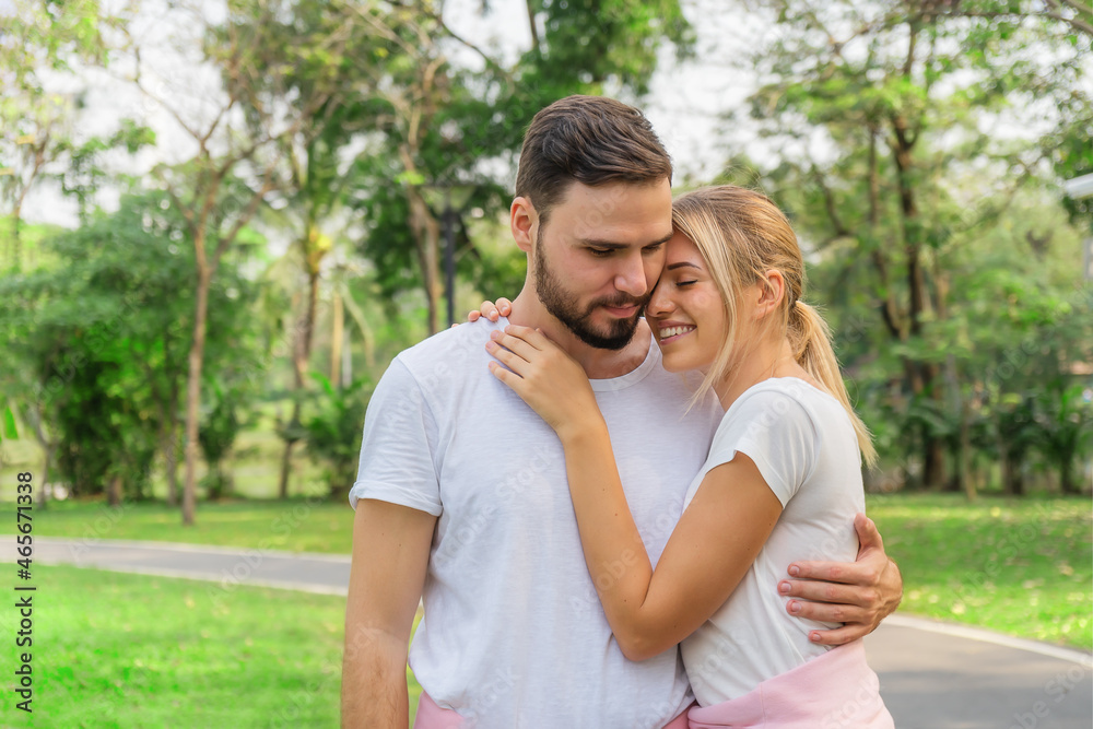 caucasian couple having romanatic moment together in park caucasian couple having romanatic moment together in park