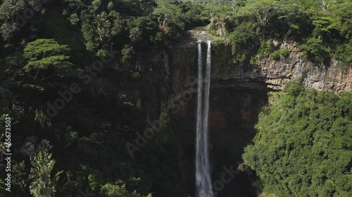 Aerial : Rotating backwards from iconic and lush jungle island waterfall Chamarel Mauritius photo