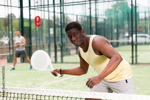 Two man playing together paddle tennis outdoor © JackF