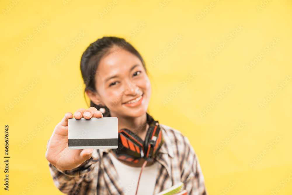 happy smiling young woman showing credit card holding happy smiling young woman showing credit card holding