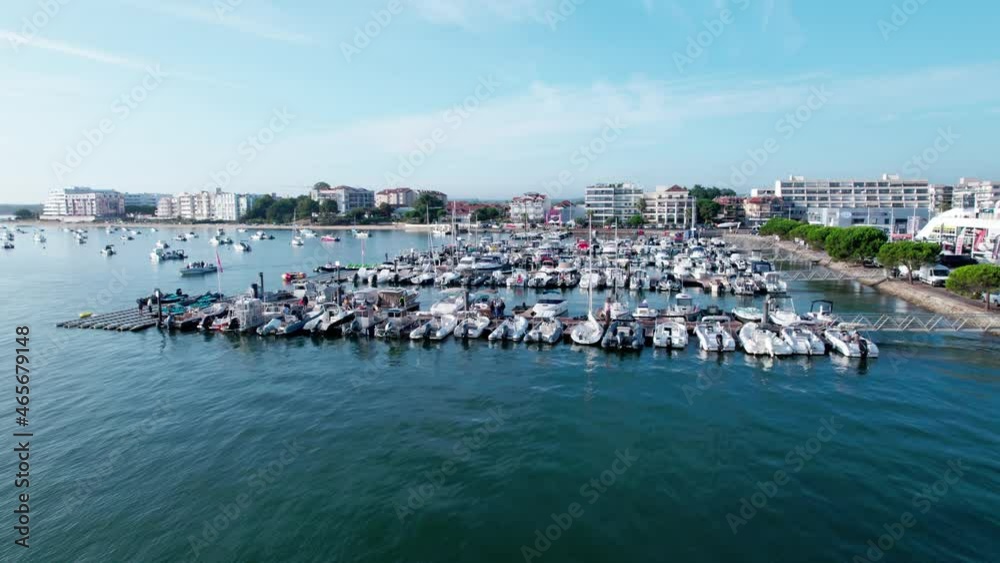 Beautiful city pier and buildings in horizon, fast flying aerial view Beautiful city pier and buildings in horizon, fast flying aerial view