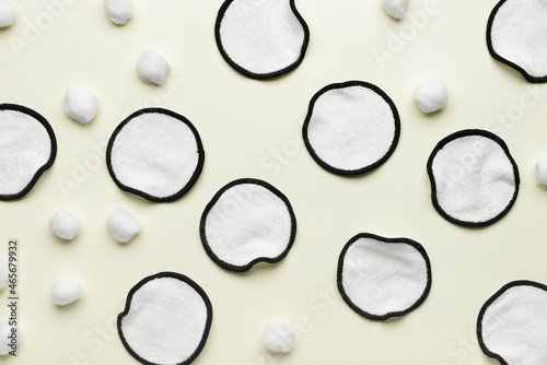Reusable cotton pads and balls on light background