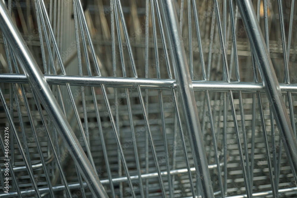 Macro of metal grilles of shopping carts
