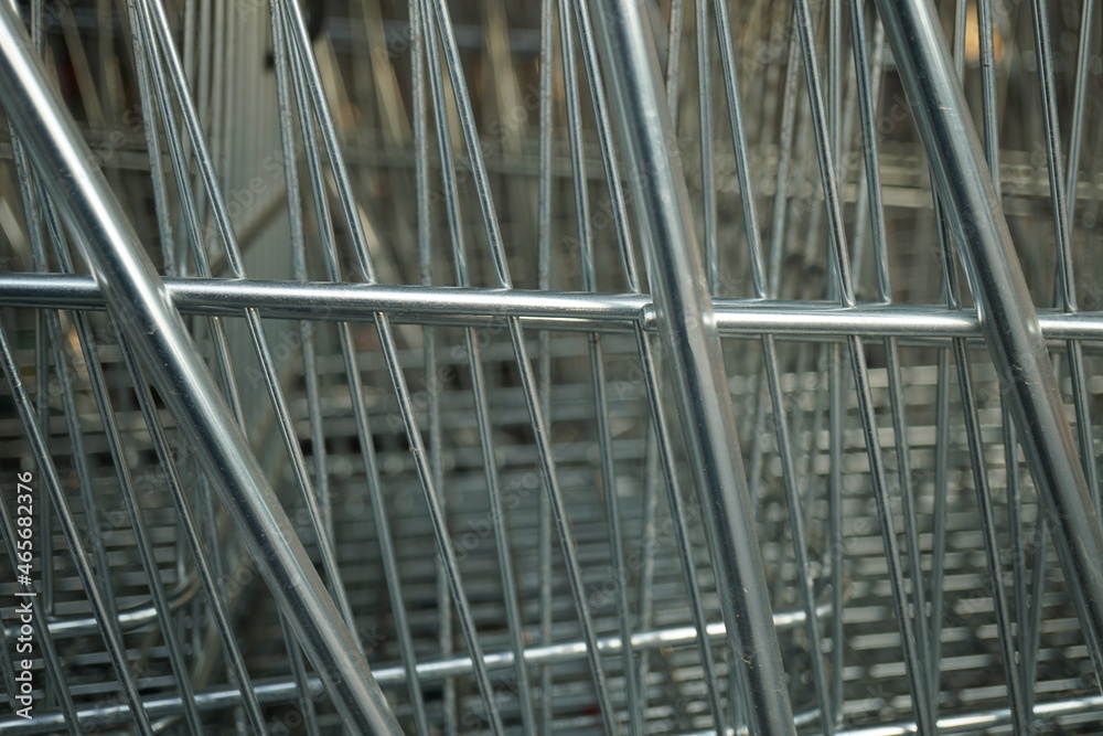 Macro of metal grilles of shopping carts Macro of metal grilles of shopping carts