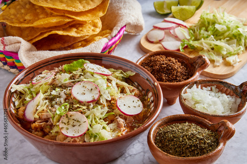 Pozole rojo, sopa mexicana de maíz, comida tradicional en México hecha con granos de maíz y carne de puerco. photo