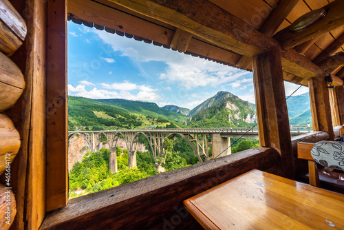 View of Tara Canyon Bridge through log cabin window,Durmitor National Park,Montenegro.