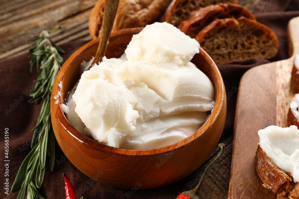 Bowl of lard spread on wooden background Bowl of lard spread on wooden background