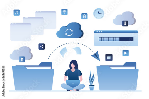 Girl copies data from one folder to another. Woman with laptop organizes information in folders