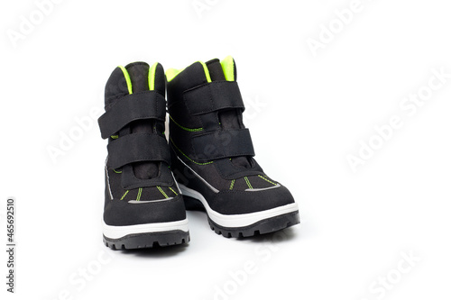 Demi-season teenage boots in dark gray with Velcro fasteners shot against a white background.