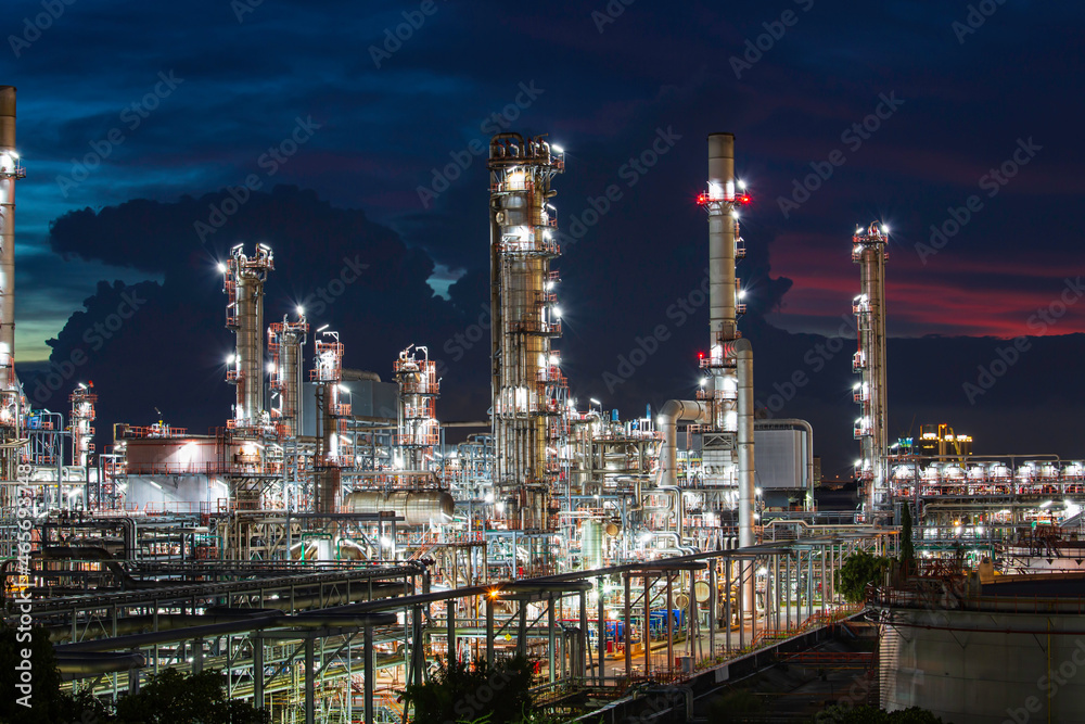 Oil​ refinery ​ and​ plant tower column refinery of petrochemistry industry in oil​ and​ gas​ ​industry with​ cloud​ blue​ ​sky cloud the twilight.