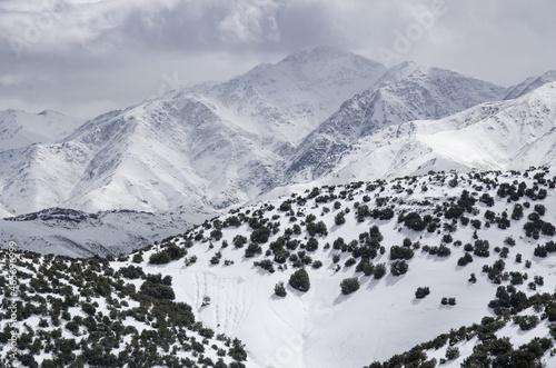 snow covered mountains, winter time high atlas morocco photo