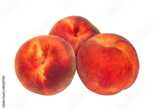 Three whole peaches on a white background