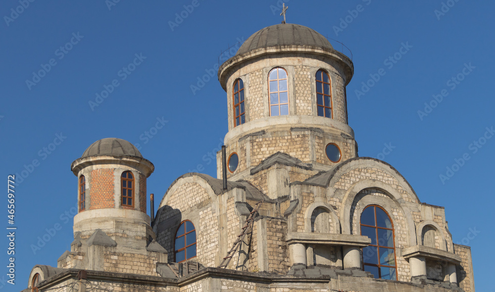 A church under construction and blue sky background