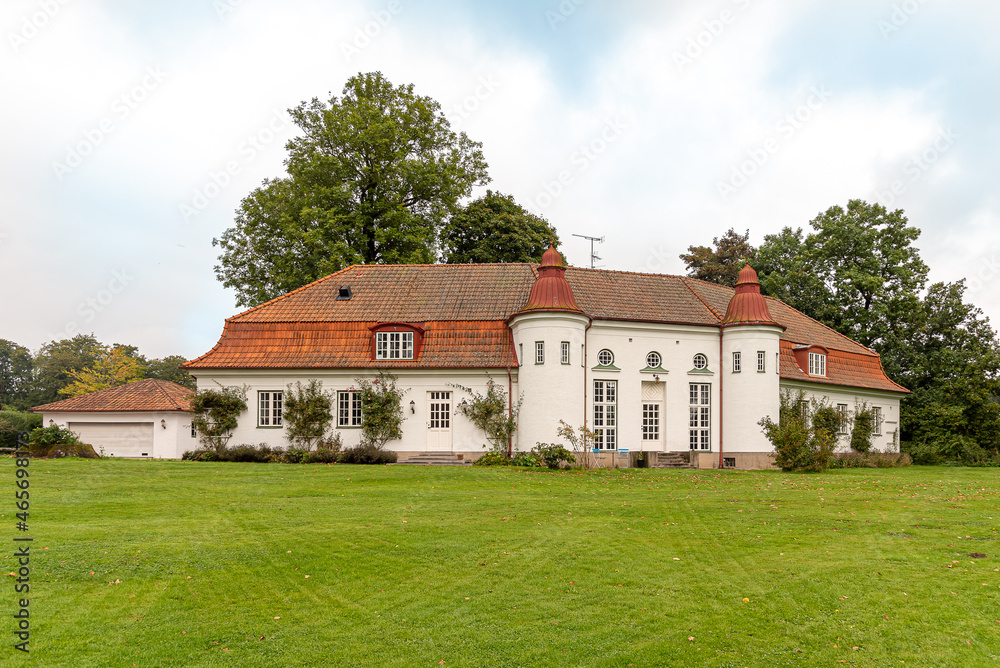 a big villa in the green park of Hjularod Castle