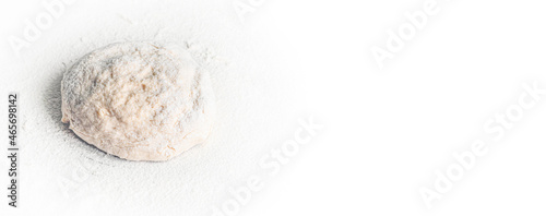Banner with lump of yeast dough sprinkled with flour. Culinary baking background with copyspace. Yeast dough for bread, spaghetti or pizza on a rolling board. Cooking bread. Kneading dough.