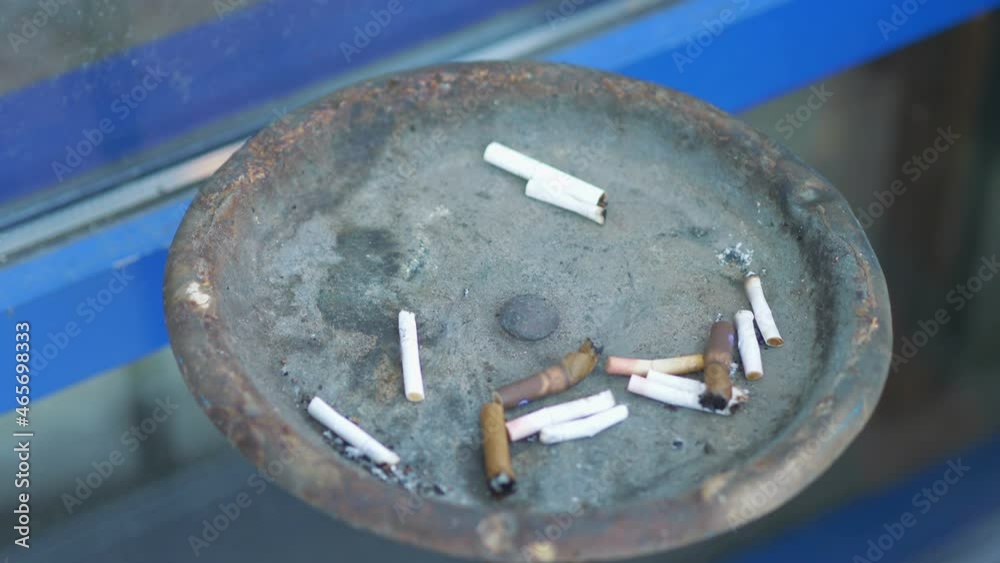 Cigarette sticks in an ashtray in 4k slow motion 60fps Cigarette sticks in an ashtray in 4k slow motion 60fps