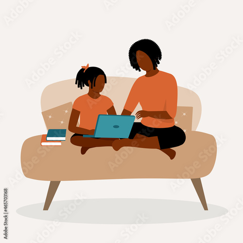 Black Mother Helping Her Daughter With Her Homeschooling Homework.