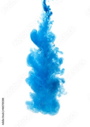 Ink in the water. A splash of blue paint. Abstract background. selective focus.
