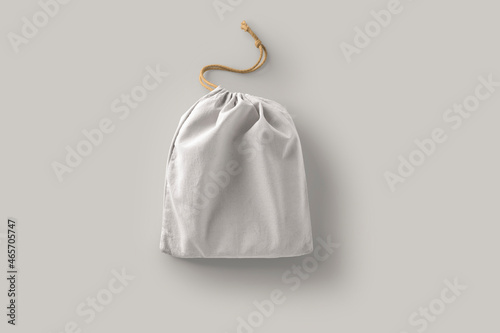 Cotton bag with drawstring Mock up isolated on grey background. Zero waste concept. 3d rendering. photo