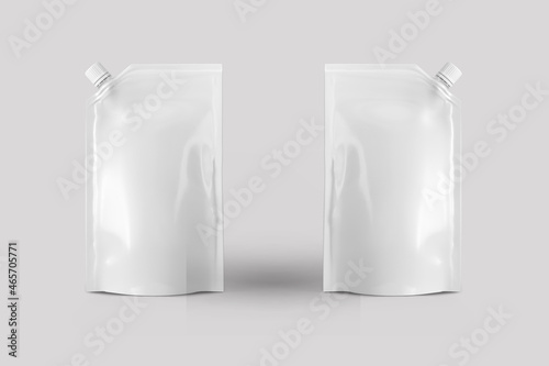 Empty Blank spout pouch, bag foil or plastic packaging mock up isolated on a grey background. Blank Food Stand Up Flexible Pouch Sachet Bag With Spout Lid. 3d rendering.