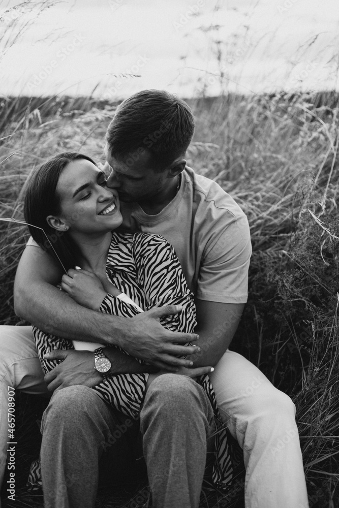 Young couple together in meadow Young couple together in meadow