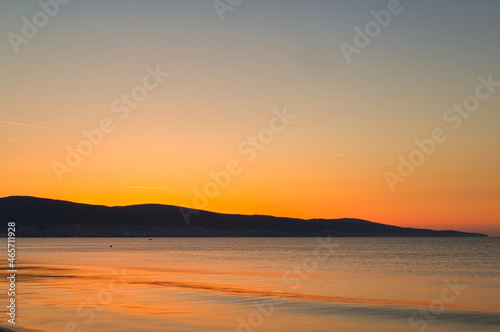red dawn over a calm sea off the Balkans