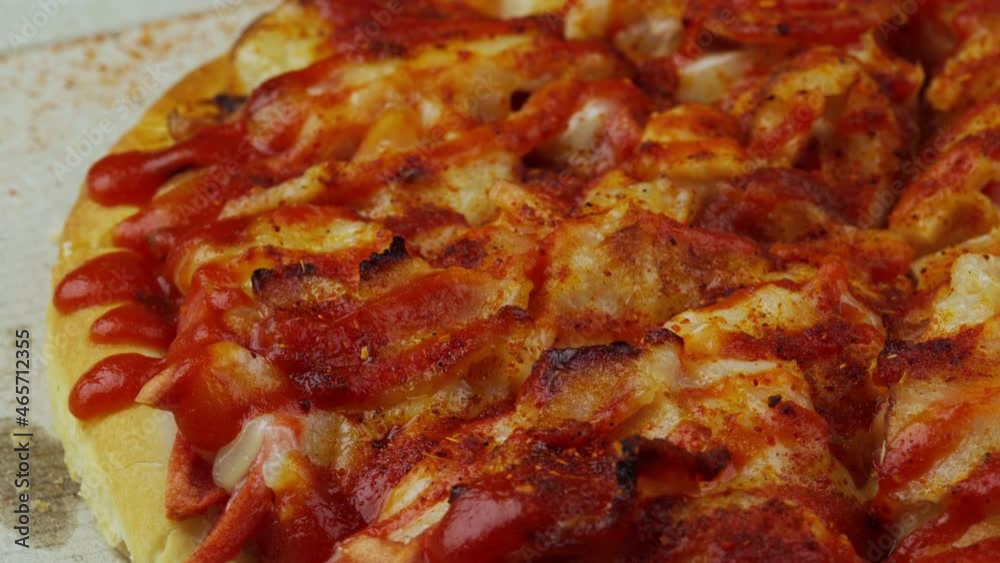 close up pizza rotating on a box close up pizza rotating on a box