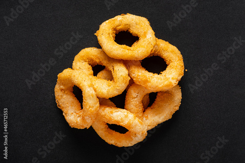 onion rings on the black background