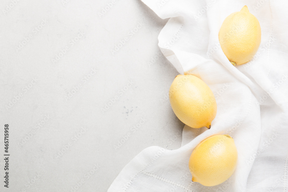 Several yellow bright lemons on a white background. Bright citruses. Several yellow bright lemons on a white background. Bright citruses.
