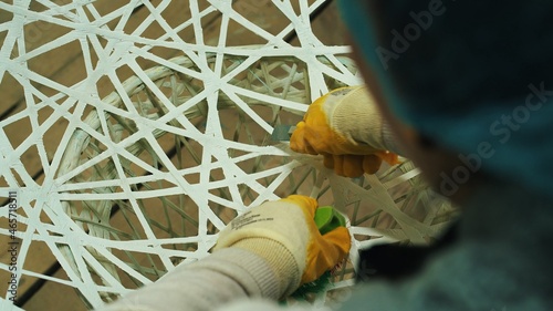 Close-up of men s hands in gloves making furniture