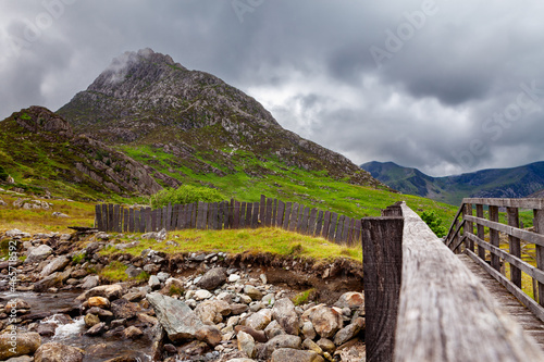 Bridge over a mountain stream in front of Tryfan - on the walk between gwern gof isaf and Llyn Ogwen in Snowdonia national park.