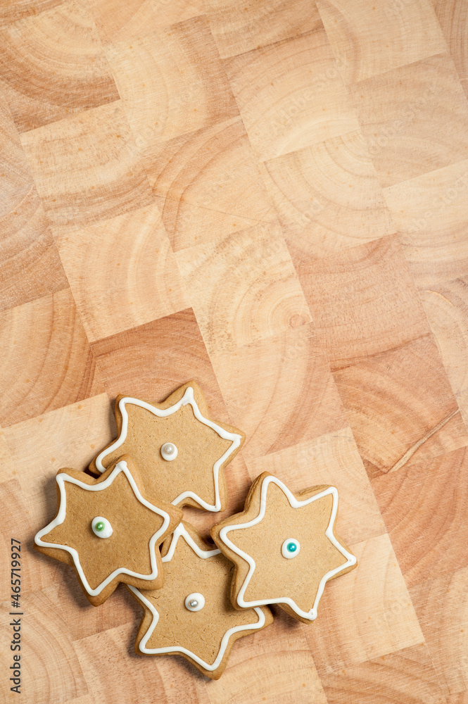 Star gingerbread cookies with frosting on wood board Star gingerbread cookies with frosting on wood board
