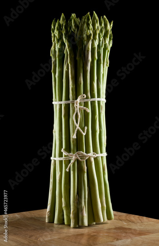 Bunch of asparagus spears  isolated on black