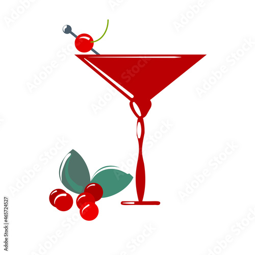 Cherry liqueur in an alcoholic glass with cherry berries.