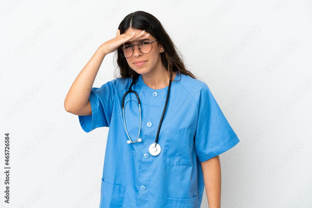 Young surgeon doctor caucasian woman isolated on white background looking far away with hand to look something Young surgeon doctor caucasian woman isolated on white background looking far away with hand to look something