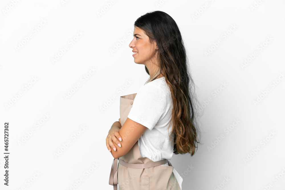 Restaurant waiter over isolated white background in lateral position Restaurant waiter over isolated white background in lateral position