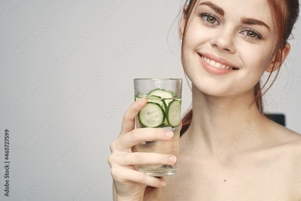woman with bare shoulders cucumber health drink Fresh woman with bare shoulders cucumber health drink Fresh