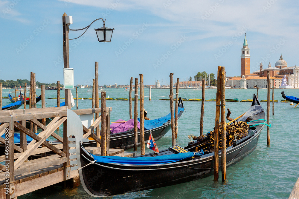 Fototapeta premium View of architecture and gondolas of Venice from Grand Canal. Beautiful colorful houses on narrow water streets, Venice, Italy. High quality photo