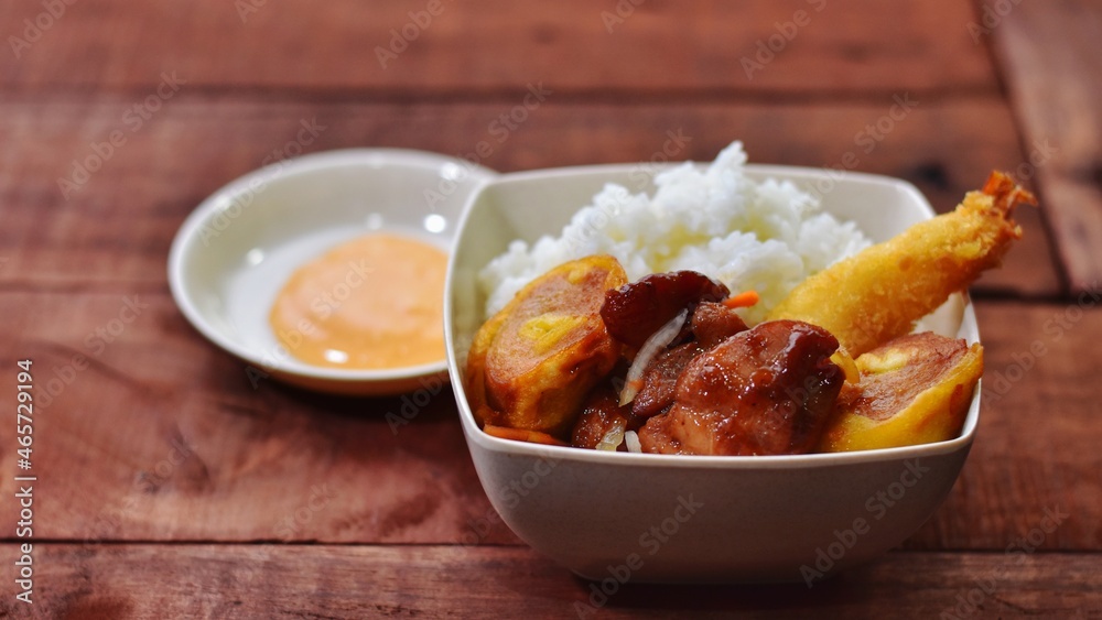 chicken with rice and vegetables with wooden background chicken with rice and vegetables with wooden background