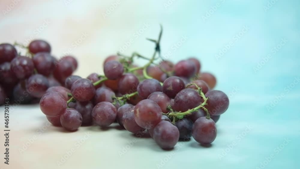 Hand drop fresh seedless grapes and panning shot Hand drop fresh seedless grapes and panning shot
