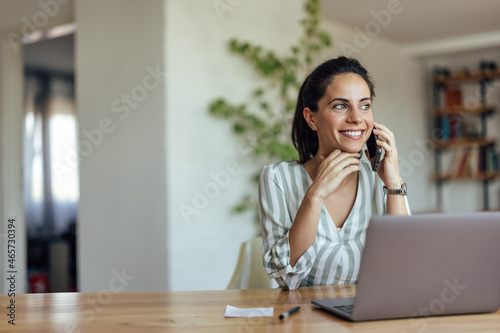 Excited adult woman, cooridanting with coworkers