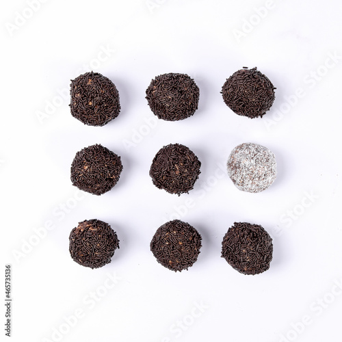 Sweet coconut and Swedish chocolate ball on white background..