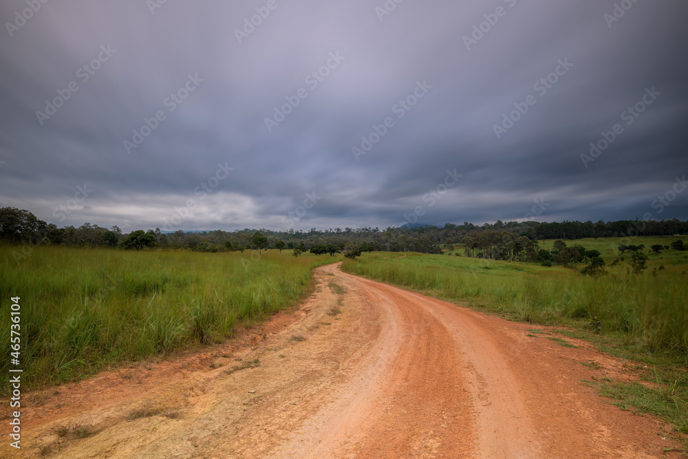 View of dirt road in countryside