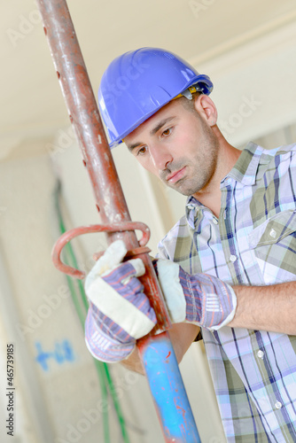 Builder setting up some scaffolding