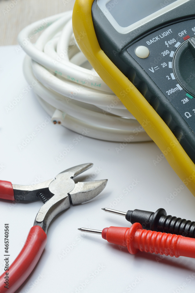 tools for electro repair on a light background. close-up. tools for electro repair on a light background. close-up.