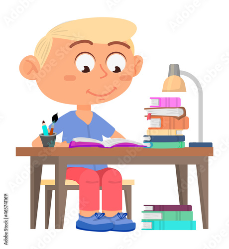 Boy studying. Kid sitting at desk. Homework concept