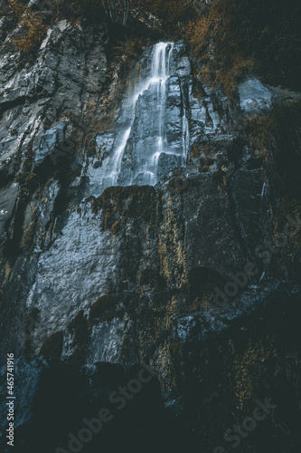 Low angle of The Nideck Waterfall with rocky cascade in France photo