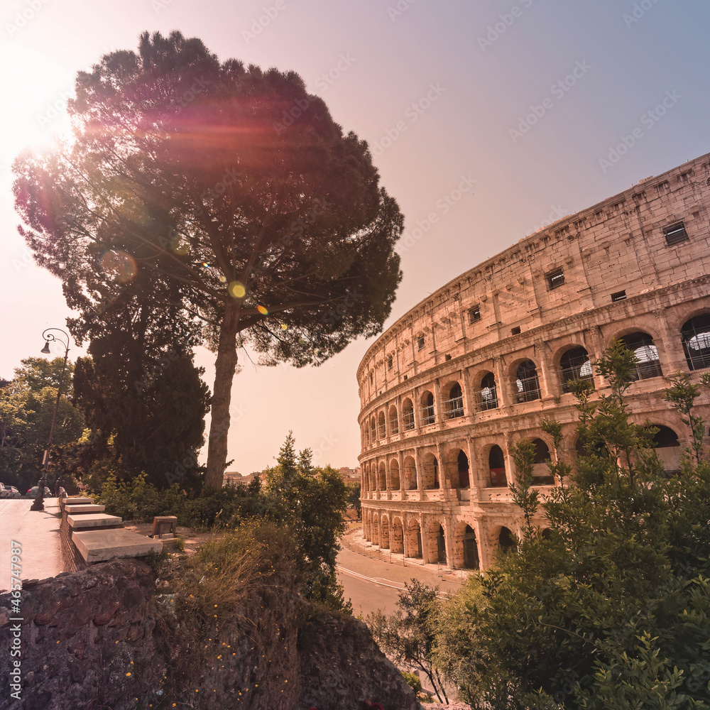 Rome Italy, view of the famous Colosseum amphitheater with impressive lens flare